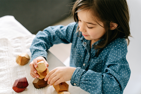 girl playing blocks